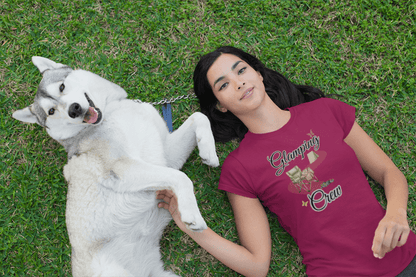 Woman lying on grass with a white dog
