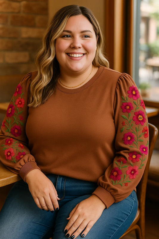 Accurate lifestyle photo of brown floral puff sleeve plus size blouse